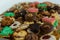 Some of Christmas cookies stored on a gold bowl of candy of different kinds of colors and shapes superimposed on each other on a