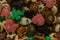 Some of Christmas cookies stored on a gold bowl of candy of different kinds of colors and shapes superimposed on each other on a