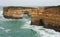 Some cliffs with holes at the Great Ocean Road in Australia