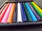 Some colorful wooden pencil isolated on black background