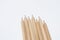 Some of the cream colored wooden pencils have sharp ends.