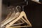 a some empty wooden hangers inside the home vintage wardrobe