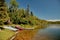 Some fishing boats ready to use in a large lake