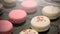 Some french macarons presented on a tray during a cocktail.