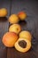 Some fresh apricots over wooden background