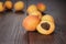 Some fresh apricots over wooden background