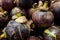 Some fresh mangosteens are ready to be sold.