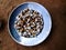 Some fried maize and soyabin in the middle of silver plate