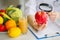 Some Fruits Such As Apples, Kiwis, Lemons And Berries On Nutritionist Table