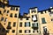 Some historic and typical houses, illuminated by the sun, in the amphitheater square in Lucca.