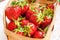 Some juicy tasty strawberries in a wooden basket