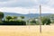 Some light poles in a field