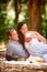 Some memories are worth holding on to. an affectionate couple enjoying a picnic in the forest.