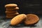 Some oatmeal cookies on dark wooden desk. Bakery products