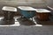 Some old used bathtubs lined up in an industrial ruin building