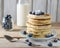 Some pancakes with blueberry on the wood table