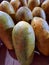 Some papayas are displayed for sale in traditional market.