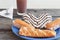 Some pastries in a plate and a chocolate milk glass for breackfast