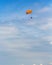 Some people parasailing over the sea