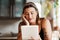 Some posts just speak to you. a young woman using a digital tablet in the kitchen at home.