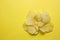Some potato chips on a yellow background