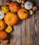 Some pumpkins and bush pumpkin on wooden background