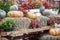 Some pumpkins with hay and flowers on old cart for Fall decoration at market place