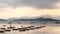 Some recreational boats on the lake, cloud and mountain