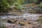 some rocks and little water in the river