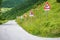 some street signs on a steep road