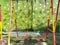 some swings made of iron and colorfully painted in a kindergarten