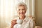 Some traditions never grow old, like my afternoon cuppa tea. Portrait of a happy elderly woman enjoying a cup of tea at