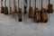 Some unfinished customed guitars and ukuleles hanging on finishing room at classical guitar workshop owned by I Wayan Tuges