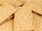 Some whole wheat crackers on white background