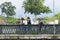 Some young women cross a bridge