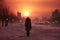 a someone is walking along trail in snowy city park, in the distance of the sunset over the houses, winter season, it\\\'s cold