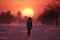 a someone is walking along trail in snowy city park, in the distance of the sunset over the houses, winter season, it\\\'s cold