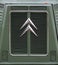 Somerset UK. October 2019. Retro Citroen logo on the front grille of a retro green Citroen van.