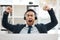 Sometimes all you need is a good yawn. a young male call center agent yawning while working in an office.