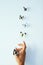 Sometimes we just have to let go. Studio shot of an unrecognizable person releasing butterflies into the air against a