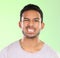 Sometimes you just gotta grit your teeth. Cropped portrait of a handsome young man making a face against a green