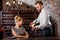 Sommelier with young woman on degustation in the