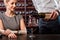Sommelier with young woman on degustation in the