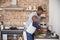 Son Helping Father To Prepare Vegetables For Meal In Kitchen