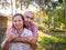 Son hugging mother in rubber plantation