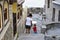 Son and mother walking on street of ?ncient city of Sozopol in Bulgaria