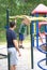 Son smiling at dad during father son bonding at the playground