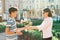 Son teenager congratulated mother with surprise bouquet of flowers, city background