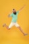 Song of happiness. Bearded man jumping with happiness on yellow background. Happy hipster enjoy listening to music in