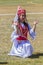 SONG KOL, KYRGYZSTAN - JULY 25, 2018: Traditional dress wearing girl during the National Horse Games Festival at the